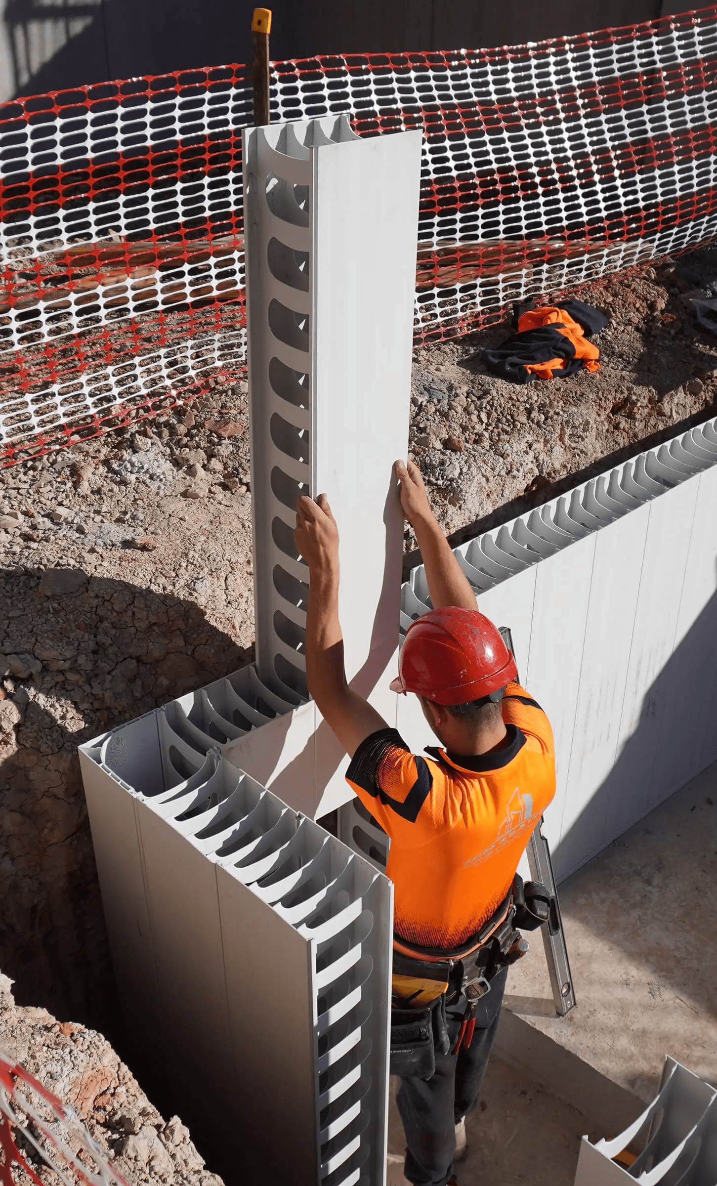 TZ Construction team member installing AFS Rediwall panels