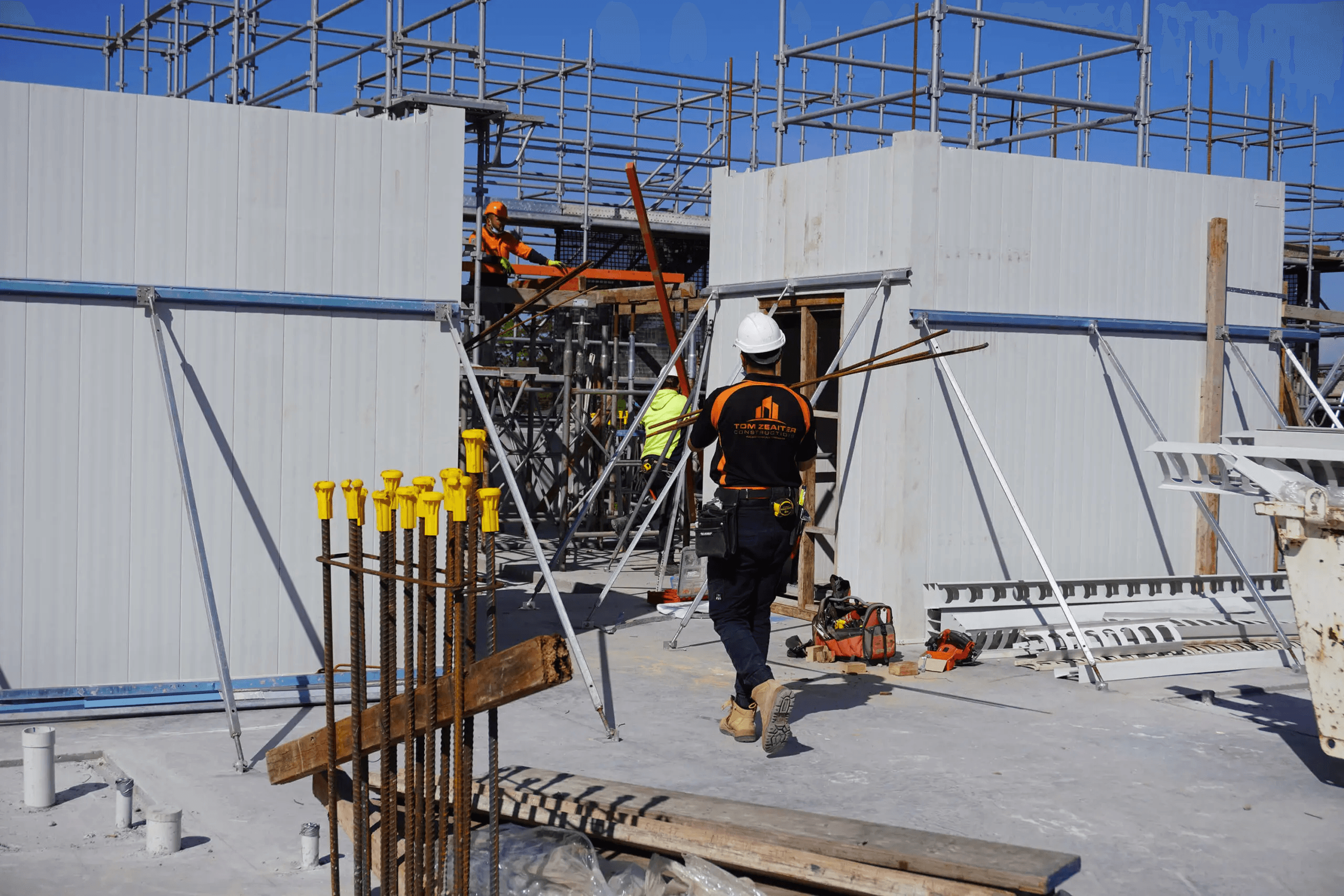 TZ Construction team member installing AFS Rediwall panels
