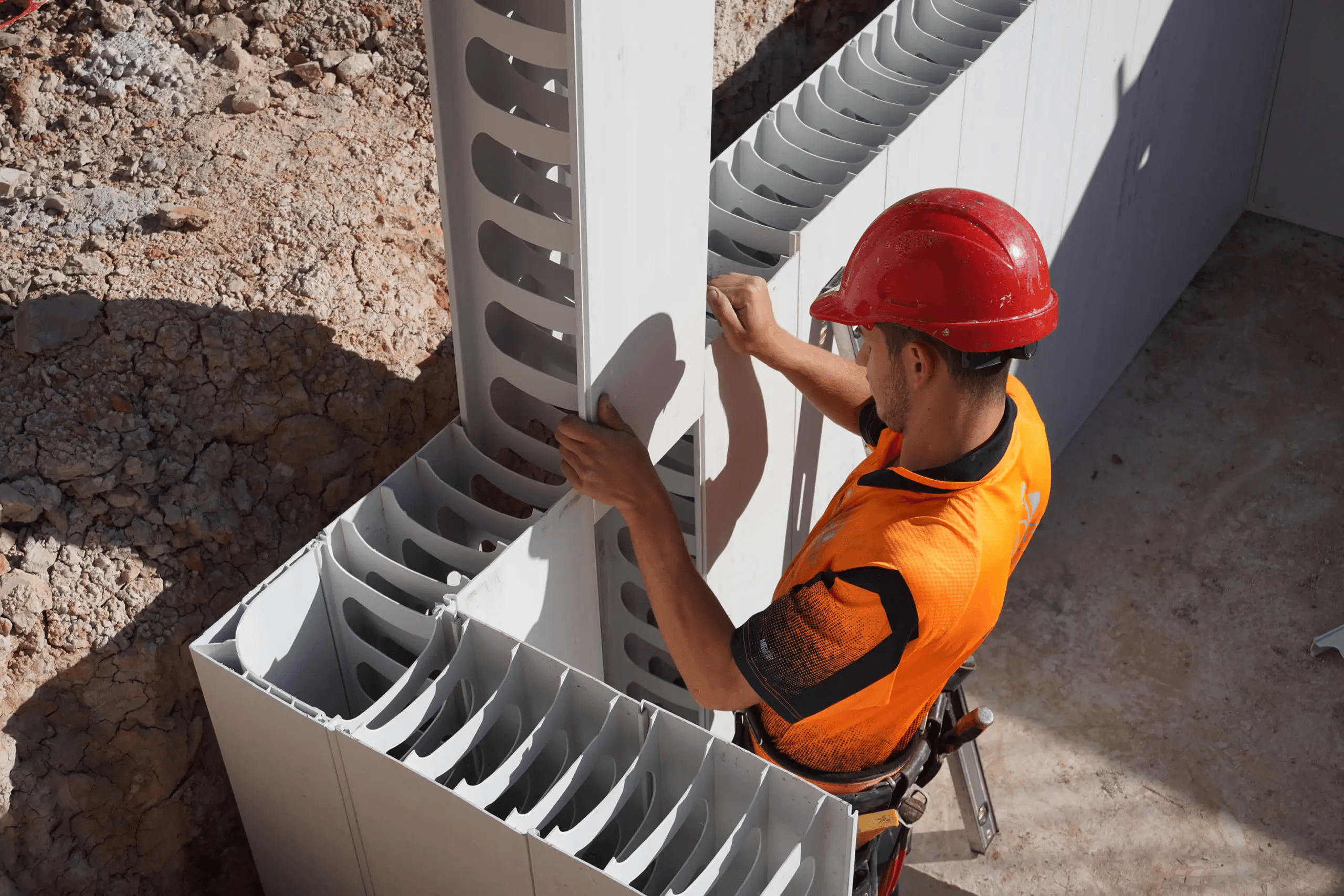 TZ Construction team member installing AFS Rediwall panels