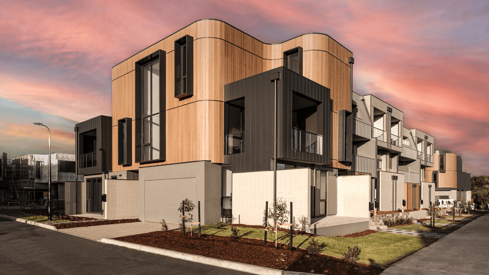 Townhouse development with curved Cemintel Territory